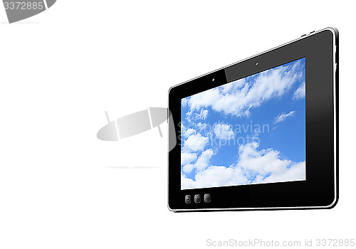 Image of black tablet with picture of blue sky isolated