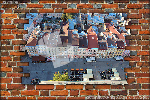 Image of brick wall and view to the house-tops in Lvov city