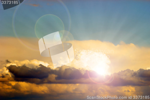 Image of beautiful sun behind the clouds