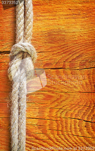 Image of rope on wooden background