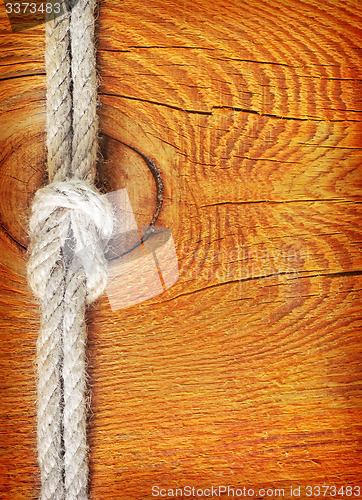 Image of rope on wooden background