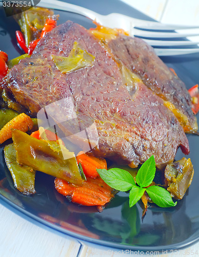 Image of baked meat with vegetables