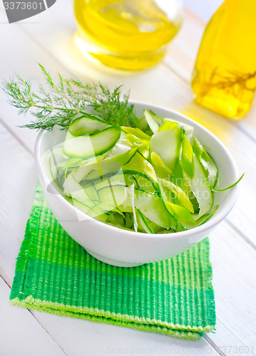 Image of Fresh salad with cucumber and greens