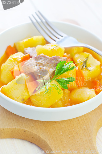 Image of potato with sauce and meat