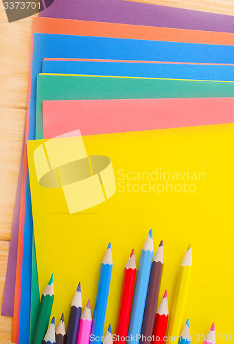 Image of color paper and pencils