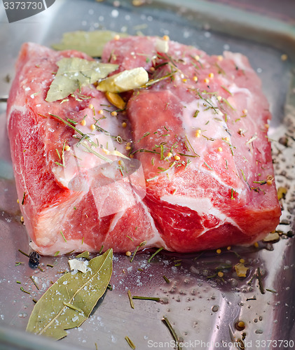 Image of raw meat with spice