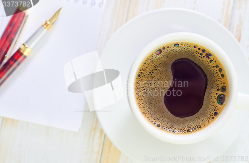 Image of coffee and note