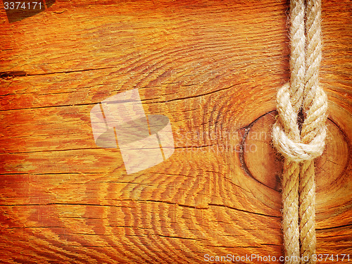 Image of rope on wooden background