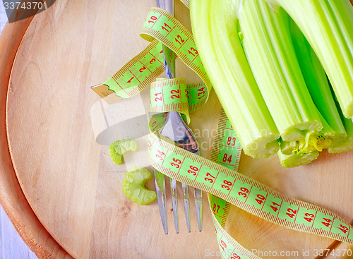 Image of metr and fork on the wooden board