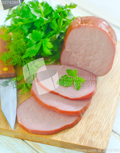 Image of Ham on wooden board