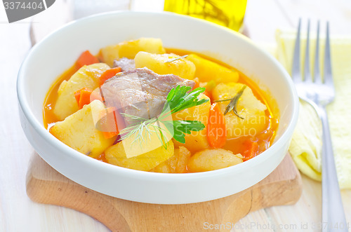 Image of potato with sauce and meat