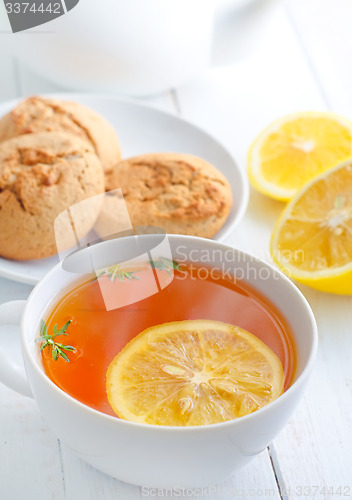 Image of Fresh tea with lemon in the white cup