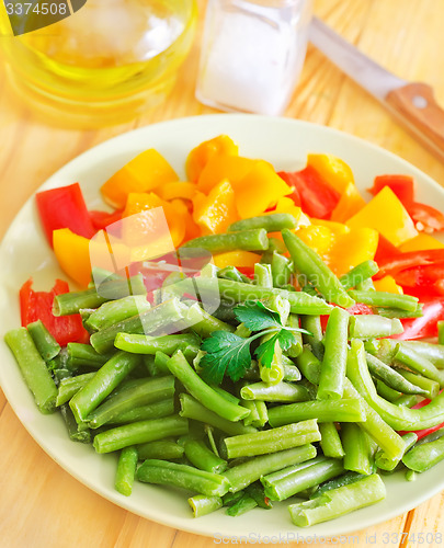 Image of Fresh raw vegetables in the green plate