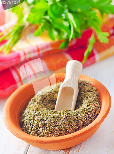 Image of Dry parsley in the bowl, green parsley