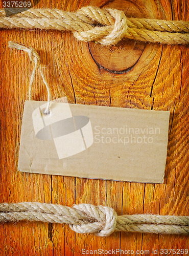 Image of rope and blank on wooden background