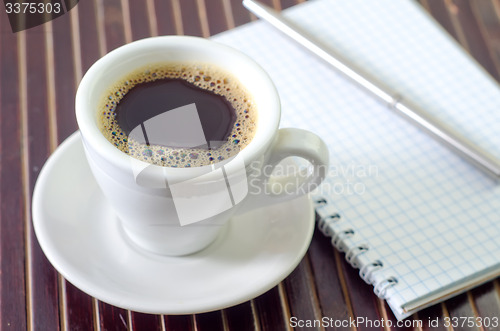 Image of coffee and note