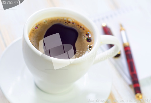 Image of coffee and note
