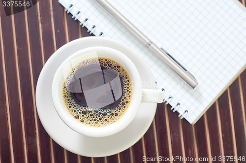 Image of coffee and note