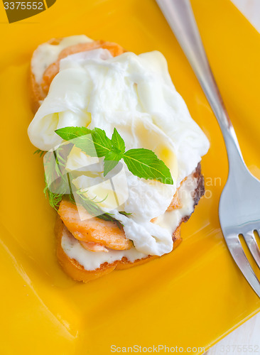 Image of Close Up of Poached Delicious Egg with Whole Grain Bread