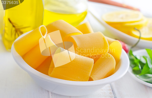 Image of raw pasta with aroma spice and oil in the bottle