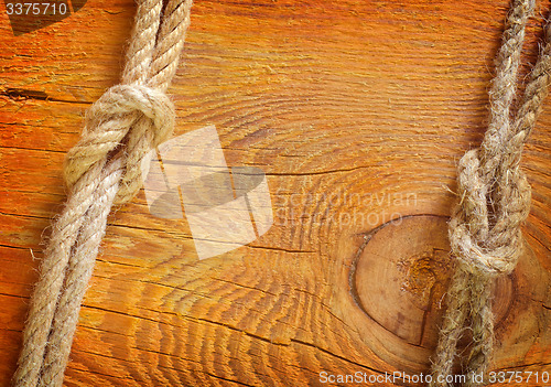 Image of rope on wooden background