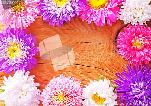 Image of flowers on wooden background