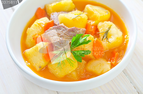 Image of potato with sauce and meat