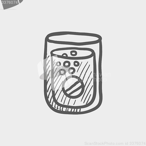 Image of Tablet into a glass of water sketch icon