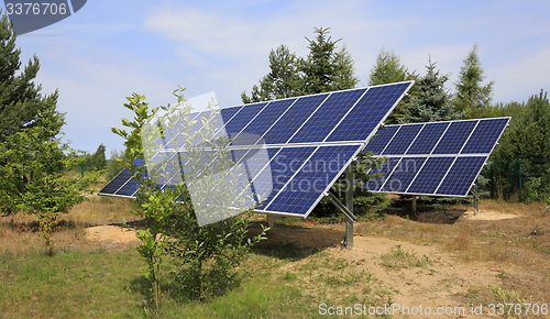 Image of Two photovoltaic panels set in backyard