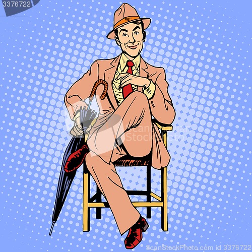 Image of Elegant man with an umbrella sitting on the stool