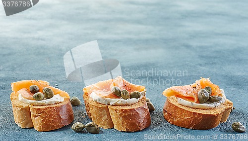 Image of toasted bread with salmon fillet and cream cheese