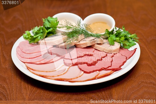 Image of meat, ham and sauce