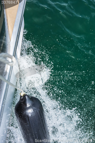 Image of wake waves from boat on lake