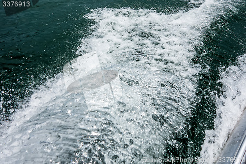 Image of wake waves from boat on lake