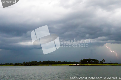 Image of tybee island beach scenes during rain and thunder storm