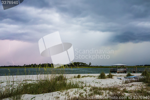 Image of tybee island beach scenes during rain and thunder storm