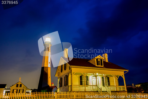 Image of tybee island beach lighthouse with thunder and lightning