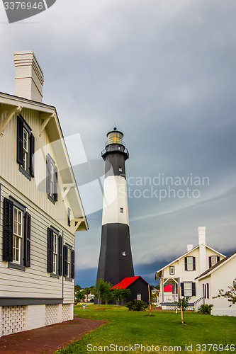 Image of tybee island beach lighthouse with thunder and lightning
