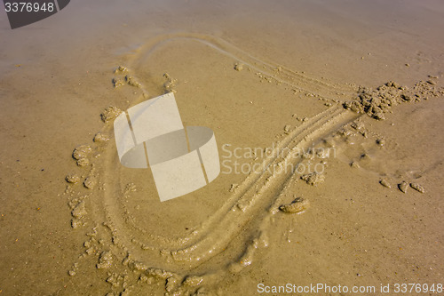 Image of Heart drawn on the beach sand
