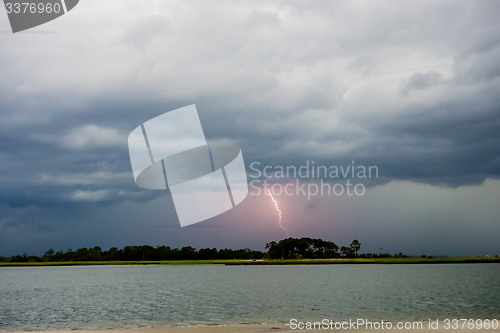 Image of tybee island beach scenes during rain and thunder storm