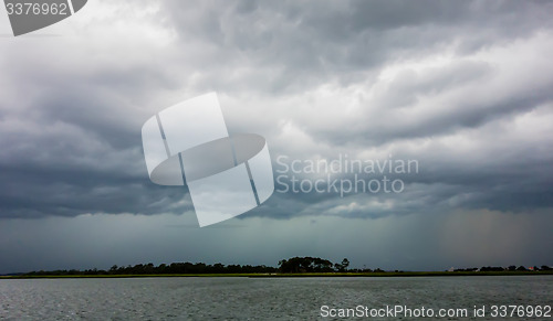 Image of tybee island beach scenes during rain and thunder storm