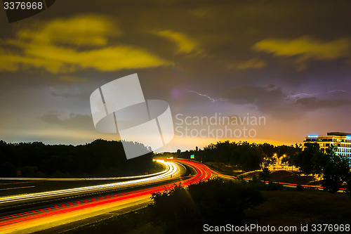 Image of thunder and lightning storm weather during evening traffic commu