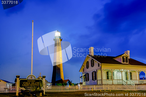 Image of tybee island beach lighthouse with thunder and lightning