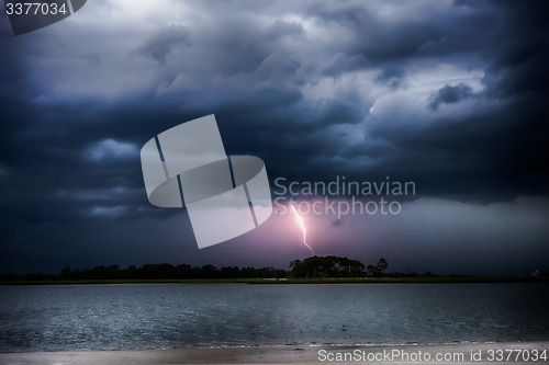 Image of tybee island beach scenes during rain and thunder storm