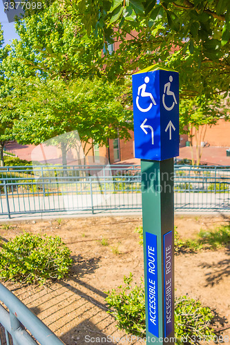 Image of blue handicapped wheel chair post sign