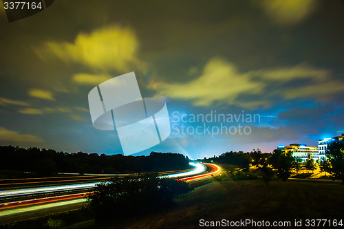 Image of thunder and lightning storm weather during evening traffic commu