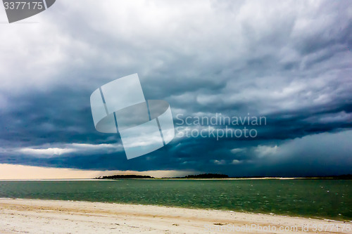 Image of tybee island beach scenes during rain and thunder storm