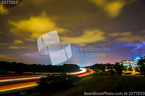 Image of thunder and lightning storm weather during evening traffic commu