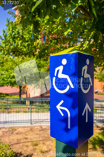 Image of blue handicapped wheel chair post sign