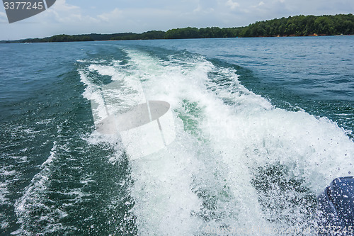 Image of wake waves from boat on lake